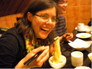 Eating noodles from hotpot